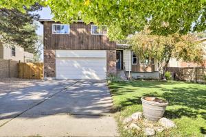 a house with a garage and a driveway at West Valley City Duplex about 13 Mi to Downtown SLC! in West Valley City