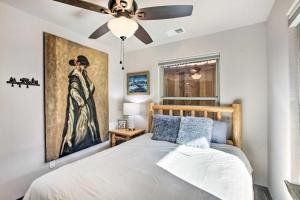 a bedroom with a bed with a painting on the wall at Unique Mtn Getaway with Stunning Outdoor Area! in Red River