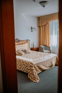 a bedroom with a bed and a window at Apartamenty Gala in Sułkowice