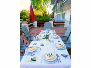 a long table with plates of food on it at Hotel Rappensberg garni in Bad Birnbach