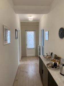 a kitchen with a counter top and a window at Casa Elodie in Bagnoregio