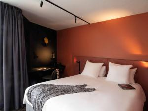 מיטה או מיטות בחדר ב-Tribe Carcassonne