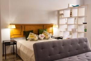 A bed or beds in a room at Amore Se Luxury Apartment