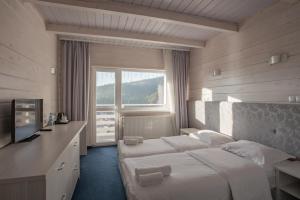Postel nebo postele na pokoji v ubytování Wellland Hotel + 37 fotografií