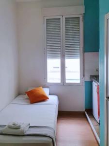 Кровать или кровати в номере Apartamentos TravelBudget Gran Vía