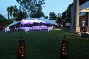 a tent with tables and chairs in a field at The Bedelle in Nairobi +18 photos