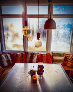 a living room with a wooden table with oranges on it at Surfviken in Stenungsund