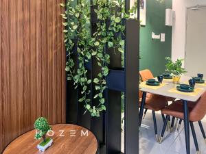 a plant wall in a room with a table at 2BR2B Hozem KL1807 Apartment Kepong in Kuala Lumpur