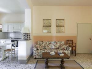 a living room with a couch and a table at Holiday Home Tuscany with Pool Access in Marti