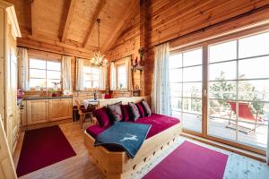 A bed or beds in a room at Almhütten Skorianz