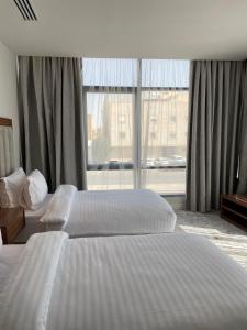 Кровать или кровати в номере شقق الشرفه للشقق الفندقيه - Shorfa Hotel Apartments