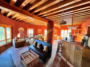 a living room with a couch and a table at Rema Resort in Paro