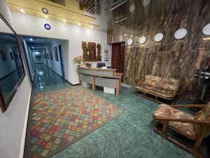 an office with a lobby with a wall with clocks at NO PROBLEM in Yerevan