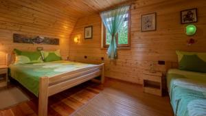 Postel nebo postele na pokoji v ubytování Chalet House Olga
