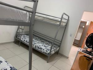 Postel nebo postele na pokoji v ubytování Pousada Internacional EAS 10min Aeroporto