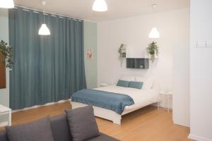 En eller flere senge i et værelse på Bonsai Apartment III