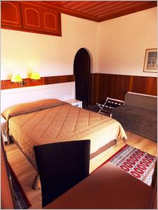 Postel nebo postele na pokoji v ubytování Hotel Olympic