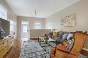a living room with a couch and a table at Cozy Historic 2BR House 10 Min to French Quarter in New Orleans