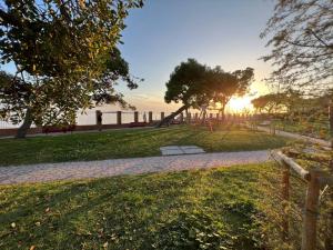 a park with a playground with the sunset in the background at New Apartment Venice - 8 min from San Marco Square in Venice