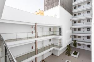 an overhead view of an apartment building with balconies at Fabuloso Apartamento nuevo con Parking y Piscina in Málaga