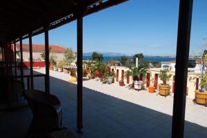 a view from the balcony of a house with plants at Villa EnElladi in Neos Pirgos
