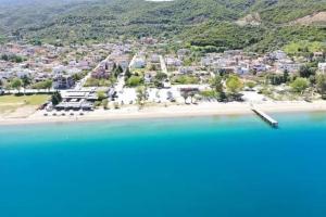 an aerial view of a resort on a beach at Villa EnElladi in Neos Pirgos