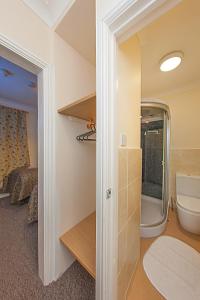 a bathroom with a sink and a toilet in a room at Riverside Hotel in Norwich