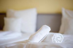Postel nebo postele na pokoji v ubytování Hotel Kapos