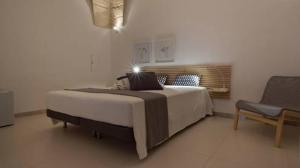 A bed or beds in a room at Rescio's Rooms
