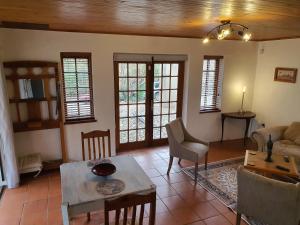 a living room with a couch and a table at Bushbaby in Centurion