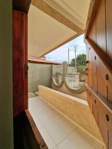 an open hallway with a balcony with two hammocks at Village São Jorge - Guest Apartment in Sao Jorge