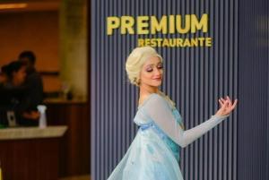 a woman in a blue dress standing in front of a wall at Salinas Premium Resort in Salinópolis +40 photos