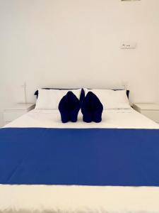 Posteľ alebo postele v izbe v ubytovaní Guest House Leo