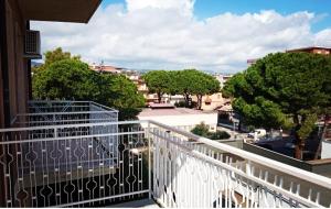 a balcony with a view of a city at Il Quadrifoglio di Triveri in Bovalino Marina