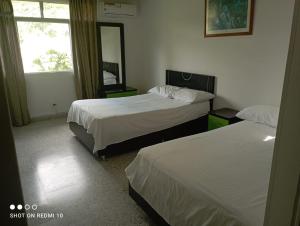 Postel nebo postele na pokoji v ubytování Hotel Albatros