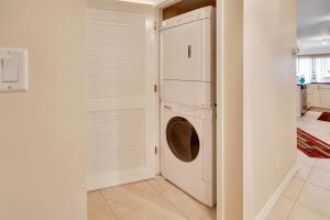 a laundry room with a washer and dryer at Land's End 10-201 Beach Front - Premier in St Pete Beach