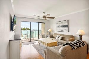 a living room with a couch and a table at Land's End 5-204 Gulf-Bay Front - Premier in St. Pete Beach