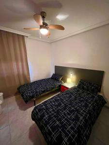 Postel nebo postele na pokoji v ubytování Piso con encanto