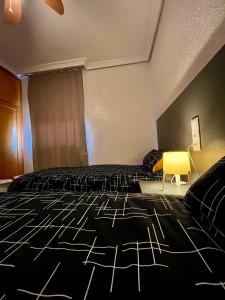 Postel nebo postele na pokoji v ubytování Piso con encanto