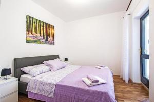 Postel nebo postele na pokoji v ubytování Apartment Andrejka