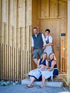a group of people posing in front of a building at Naturhotel & Chalets Euler in Neuschönau