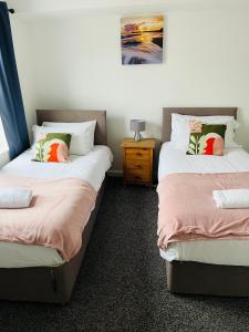 מיטה או מיטות בחדר ב-Wymington House