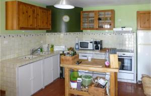 a kitchen with a sink and a stove top oven at 6 Bedroom Awesome Home In Entrecasteaux in Entrecasteaux