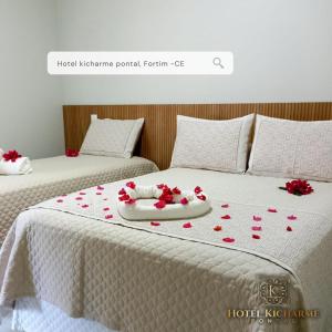 two beds with red hearts on the blanket at HOTEL KICHARME PONTAL in Fortim +21 photos