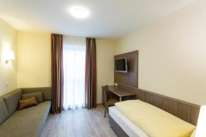 TV a/nebo společenská místnost v ubytování CityApart Hotel