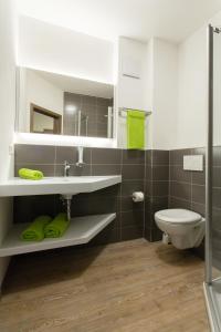 Koupelna v ubytování CityApart Hotel