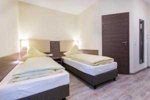 Postel nebo postele na pokoji v ubytování CityApart Hotel