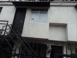 a house with a window with a sign in it at Apartamento de lujo en Dosquebradas #201 in Dosquebradas