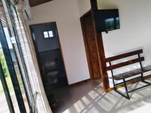 a chair sitting in a room with a window at Primero de Abril in General Belgrano