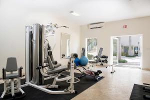 a gym with cardio equipment in a room at Sea Esta Studio I - Ideal for Couples! in Turtle Cove